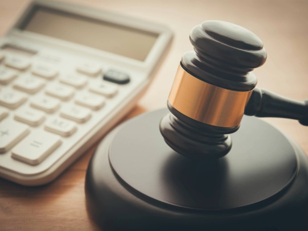 Self-employment legal and financial, Image of calculator and judge's gavel