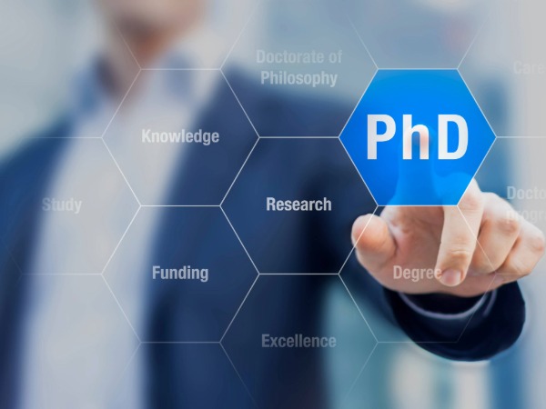 Phd students, Image showing PhD and hand pointing to knowledge, research, excellence hexagons