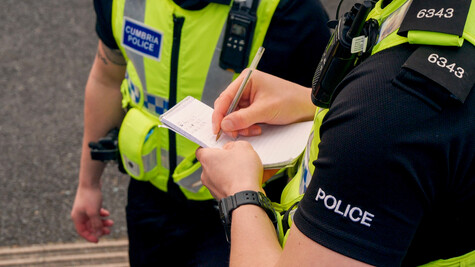 A student police officer taking a statement.