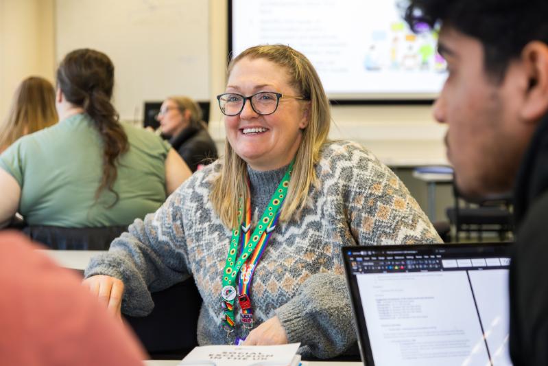 Lecture wearing a sunflower lanyard