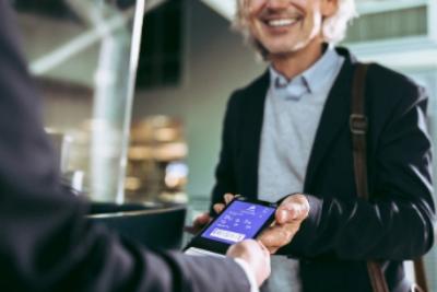 A man showing a mobile phone QR ticket