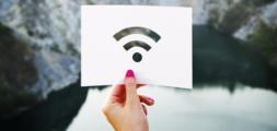 wifi_image, woman holding white paper with the wifi logo