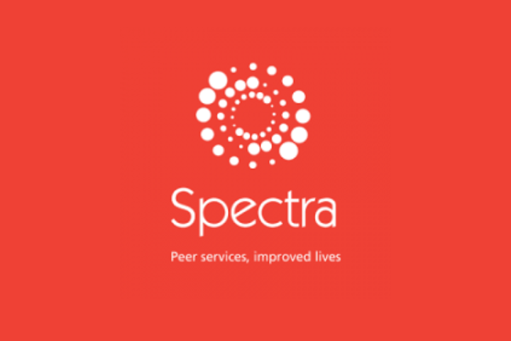 Spectra's (a trans support charity) logo on a red background.