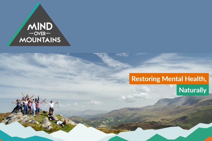 The image is a photo of a group of people up a mountain in the Lake District, the top left has the 'Mind over Mountain' logo and accompanying text that reads 