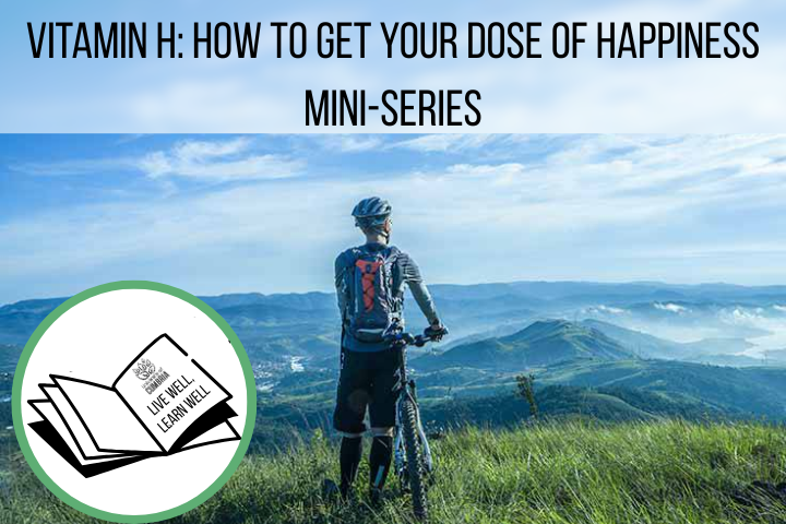 The photo shows a man stood with his back to us, he is stood overlook a Lake District fell with his mountain bike. The text reads: 