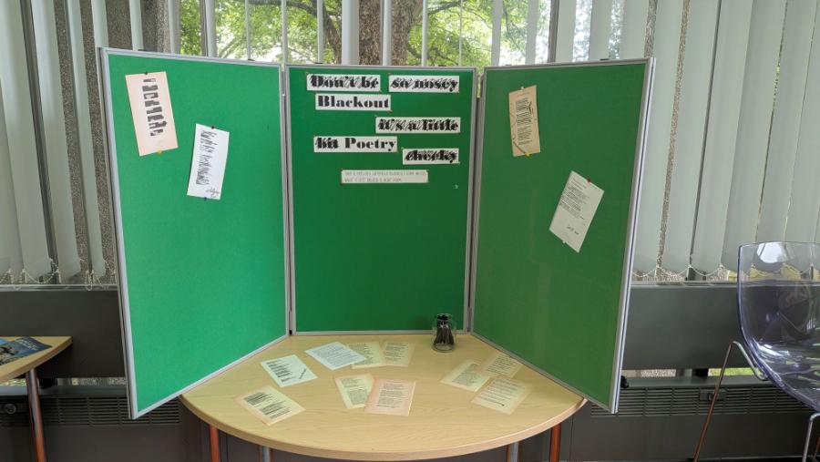 Blog image, notice board with posters of poetry for blackout poetry activity