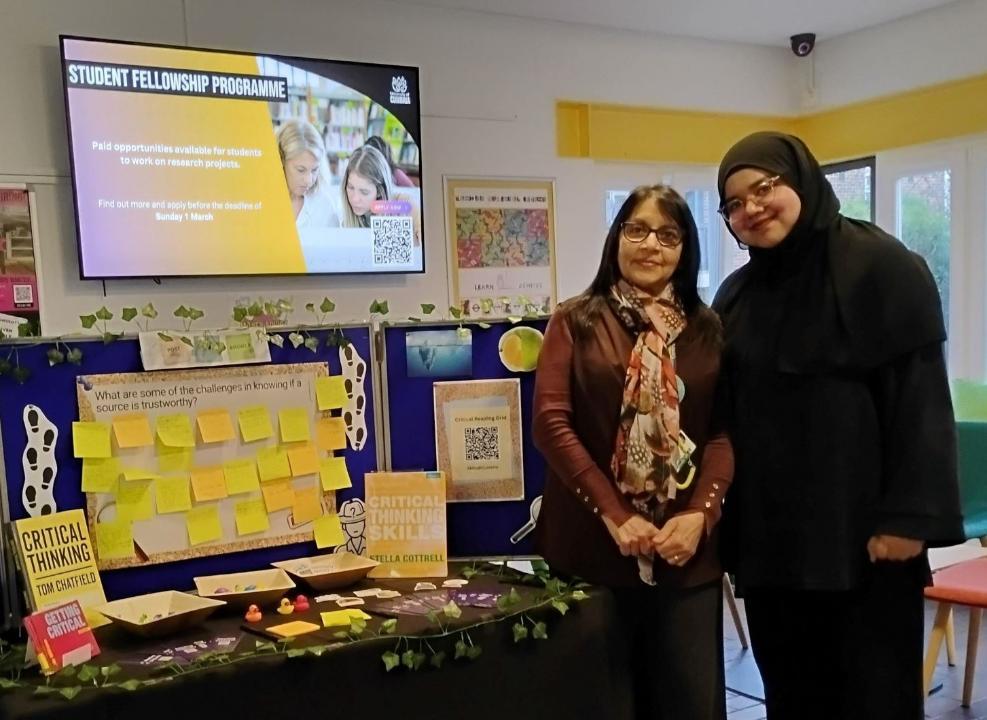 Rectangular photo - LANDSCAPE - Optimised for web, London library staff with pop-up display.