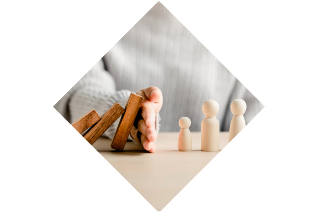 Health and Safety Image , Hand protecting dominos from falling