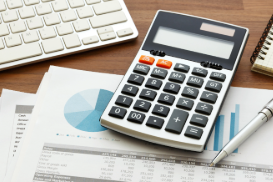 A calculator on a desk.