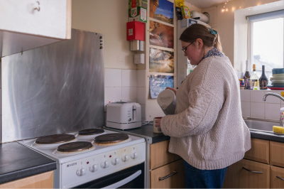 Student making a cup of tea in accommodation halls