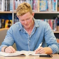 Student using a reader pen, Student using a reader pen