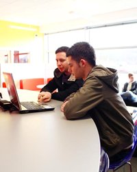 EnergusBoysonLaptop, Two males working on a laptop 