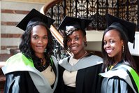 Graduation, Three women stood on a staircase at their graduation 